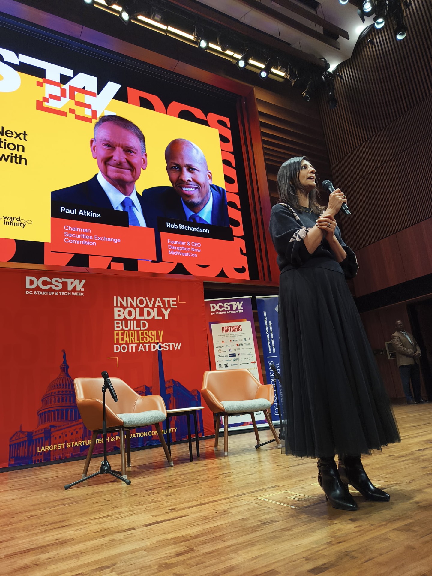 Seema Alexander speaking on stage